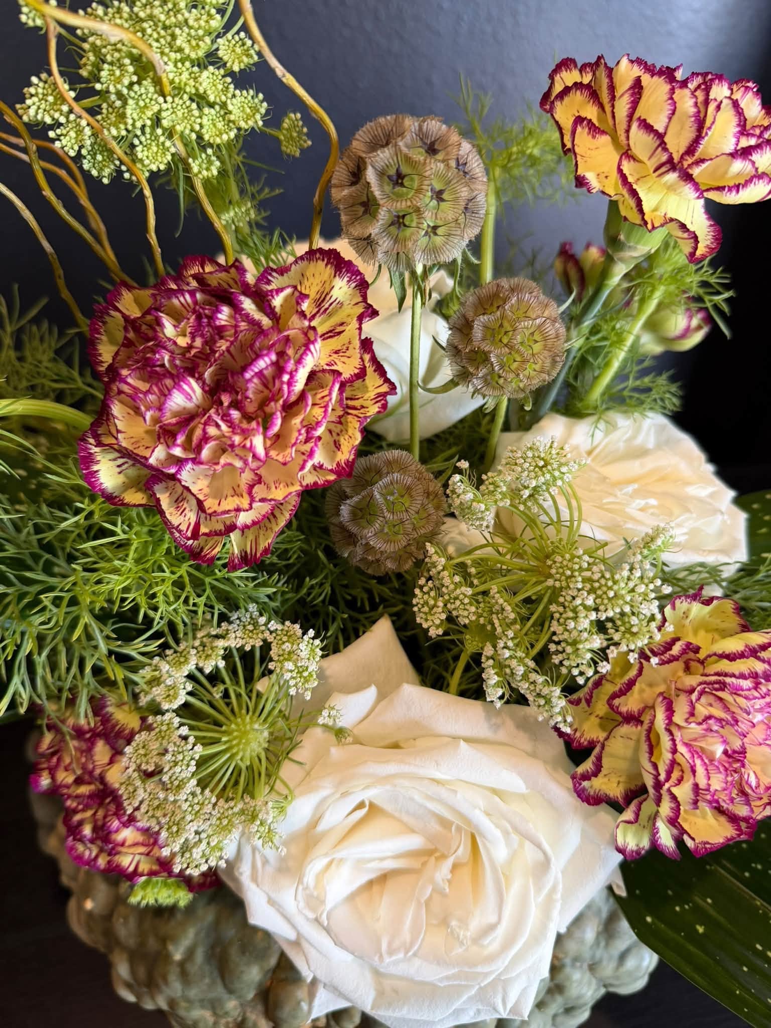 White roses and antique-toned flowers